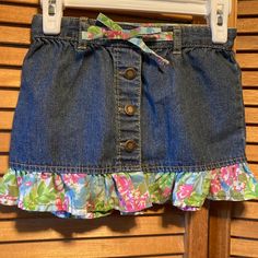 Denim Skirt With Ruffled Print At The Bottom And Bow At The Waist With Adjustable Elastic Waistband. Size 2t. 100% Cotton. Nwot Playful Denim Blue Bottoms For Spring, Cute Denim Bottoms With Ruffles, Playful Medium Wash Bottoms For Spring, Casual Ruffled Bottoms For Playtime, Spring Ruffled Bottoms For Playtime, Spring Playtime Ruffled Bottoms, Playful Medium Wash Cotton Bottoms, Playful Blue Ruffled Bottoms, Cute Dark Wash Cotton Bottoms