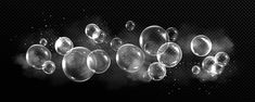 some bubbles floating in the air on a black background