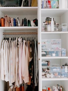 an organized closet with clothes and other items