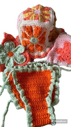 two crocheted items are sitting next to each other