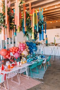 an outdoor party with colorful balloons and decorations