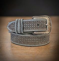 "PERSONALIZATION - Engrave your belt with your own custom message LENGTH - 1-1/2\" Wide (38 millimeters wide) FIT - With a 5\" room for adjustability, you'll be able to cinch your handmade leather belt as tight as you please. Our country western belt is available in sizes 28\"-46\". For the right fit, pick your belt at 2\" longer than your waist size. (Example, if you wear a size 36 pants, you should order a size 38 belt) DURABLE BUTTONS - This handmade leather belt has quality snap buttons, very difficult to break, and has a convenient snap system for interchangeable buckles at any time, feel inspired to customize your western style men's belt. Simply open up the snap-on buttons to install your own buckle. BUCKLE - Handmade stainless steel bull buckle  COWBOY GIFT IDEA - This men's classi Tooled Belt, Cowboy Buckle, Cowboy Gifts, Handmade Leather Belt, Western Belt, Belt Design, Men's Belt, Western Belts, Genuine Leather Belt