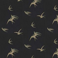 a flock of birds flying through the night sky