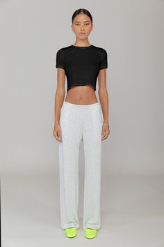 Cut in our stretch cotton rib, The Kelly Crop Slim Fit Tee is a modern classic. Featuring a classic crew neckline and cropped length, this is the perfect pair for a high waisted pant. Basic Cropped T-shirt For Loungewear, Fitted Tops With Elastic Waistband For Loungewear, Casual Stretch Bottoms With Cropped Hem, Basic Crop Top For Loungewear, Spring Cropped Fitted T-shirt For Loungewear, Stretch Cropped Pants For Workwear, Fitted Casual Cropped T-shirt For Loungewear, Versatile Relaxed Fit Crop Top For Loungewear, Versatile Cropped Bottoms For Loungewear