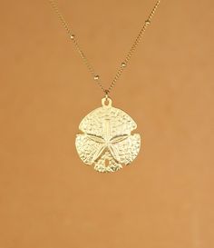 Sand dollar necklace - gold sand dollar - star fish necklace - sea star - a 22k gold vermeil sand dollar on a 14k gold vermeil chainA 14k gold vermeil sand dollar hanging from a 16 inch 14k gold filled satellite chain. Please feel free to select a different length if you prefer...  This beauty is also available on a classic 14k gold vermeil chain (without the little gold spacer beads :) The sand dollar measures 20mm.Here is a set of super cute sand dollar stud earrings... https://www.etsy.com/li Gold Starfish Shaped Dainty Jewelry, Dainty Starfish Gold Jewelry, Dainty Gold Starfish Jewelry, Gold Sterling Silver Jewelry With Starfish Charm, Gold Starfish Charm Jewelry In 14k Gold, 14k Gold Starfish-shaped Jewelry, Gold Jewelry With Starfish Charm In 14k Gold, 14k Gold Jewelry With Starfish Charm, Sand Dollar Earrings