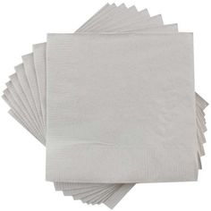 white napkins are stacked on top of each other