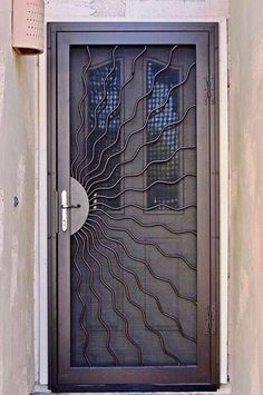 a black door with an intricate design on it