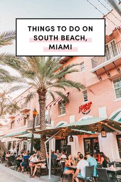 people sitting at tables in front of a pink building with palm trees and the words things to do on south beach, miami