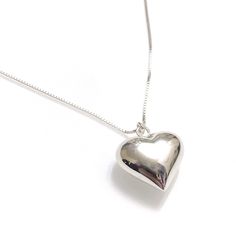 A fun and cute piece to throw on over a turtleneck sweater or tunic or tank, this sterling silver necklace will make you smile and give you all those good lovey vibes for many a lifetime.  Puffy heart pendant measures approximately 20mm across and the box chain is 30 inches long.  Gift it to someone special using our complimentary gift shipping option or treat yourself to this beautiful necklace. Silver Long Necklace, Puffy Heart Necklace, Chunky Pendant, Sterling Silver Heart Pendant, Long Silver Necklace, Puffy Heart, Silver Heart Necklace, Necklace Sterling Silver, Sterling Silver Heart