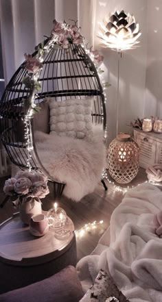 a bird cage with lights around it in a bedroom