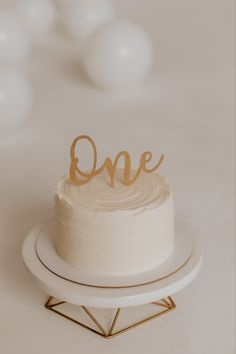 a cake with the word one written on it