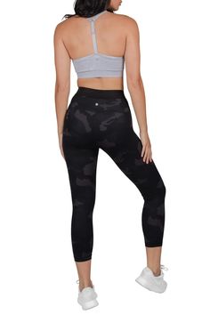 Lounge around in luxury with our innovative LUX material! This super soft, breathable, and thick fabric feels amazing against your skin and also stretches to move with you. Due to the high quality, durable fabric, these camo capris are a great choice for a variety of activities like running. Supportive waistband. Pulls on. Fitted leg. High waisted. Camo print. Approx. 10" rise, 22" inseam (size S). Imported    This item cannot be shipped to Canada. Versatile Black Tights With Wide Waistband, Black Versatile Tights With Wide Waistband, Black Tights With Wide Waistband, Black Compression Capris For Sports, Tight Black Activewear With Wide Waistband, Black Tight Activewear With Wide Waistband, Stretch Black Capris For Sports, Black Stretch Capris For Sports, Sporty Black Yoga Pants With Snug Fit