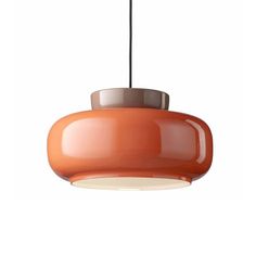 an orange light hanging from a ceiling fixture