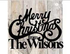 merry christmas from the wisonss on wood background with text that reads merry christmas from the wisons