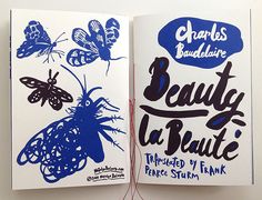 an open book with blue butterflies on it and the words beauty la beaute written in black