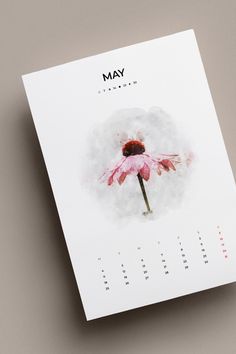 a calendar with a pink flower on the front and back cover is shown in this image