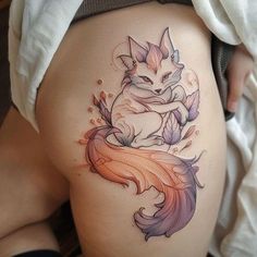 a woman's thigh with a fox tattoo on it