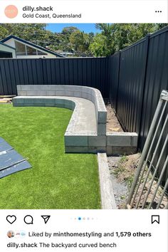 a backyard with artificial grass and fenced in area