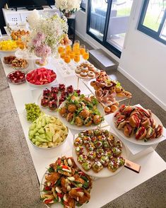 an assortment of appetizers and snacks on a buffet table