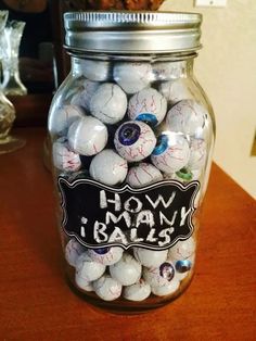 a glass jar filled with lots of white balls