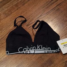 Nwt With Tags Black Cotton Bra With Black Elastic Band With Calvin Klein Wrote In White On It Adjustable Straps Fabric Content And Care Instructions In Photos Calvin Klein Black Stretch Bra, Calvin Klein Fitted Top For Loungewear, Black Summer Bra For Loungewear, Black Loungewear Bra, Calvin Klein Bralette, Calvin Klein Ck One, Calvin Klein Bra, Cotton Bra, Lace Halter Bralette