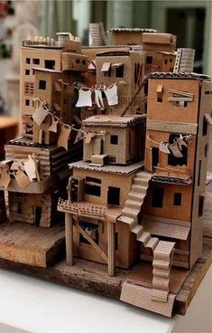 a model of a house made out of cardboard