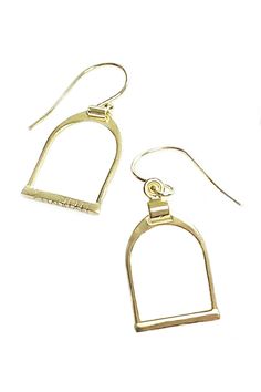 A classic English stirrup is beautifully hand cast in 14K gold vermeil. Modern, elegant and the weight is perfectly balanced. Classic equestrian beauty and a nod to English riders and style aficionados. 14 Karat Gold, Sterling Silver Stirrup Charm is .6" W x .9" L x .75" Drop Dangle Earring Handcrafted in India Ships from the USA Why do we love this earring? We love anything equestrian, and the styled stirrup icon is richly detailed and paired with 14k gold creates a gorgeous earring. Such a uni Classic Formal Jewelry With Brass Hardware, Classic Gold Jewelry With Brass Hardware, Classic Horseshoe Jewelry, Elegant Sterling Silver Jewelry For Shows, Elegant Adjustable Jewelry For Shows, Elegant Horseshoe Earrings For Gift, Stirrups, Earrings In Gold, Hand Cast