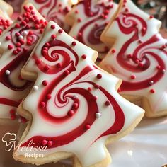 red and white decorated cookies on a plate