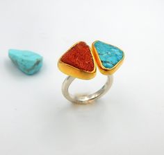 Rough Turquoise and Coral ring made out of 18 karat Gold plated Sterling Silver. 100% Handmade Jewellery. CORAL: Unlike most other gemstones which are of mineral origin, Coral is organic, formed by living organisms. It forms from branching, antler-like structures created from coral polyps in tropical and subtropical ocean waters. When the coral polyps die, the hardened skeleton remains, and this material is what is used as a gemstone. Most coral is white, but nature can create coral in several o Coral Polyps, Raw Turquoise Ring, Living Organisms, Bezel Jewelry, Summer Rings, Peridot Pendant, Chunky Ring, Lapis Lazuli Ring, Coral Ring