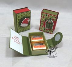 an open gift box with some candy in it