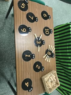 a wooden board with numbers and numerals on it