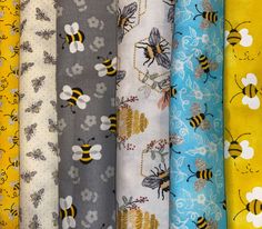 many different types of bees and flowers on fabric