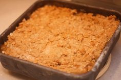 a pan filled with food sitting on top of a counter