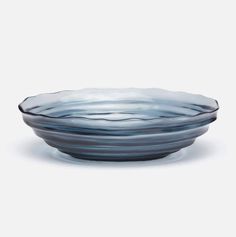 a glass bowl sitting on top of a white table