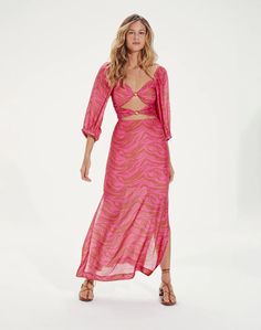 Razzle and dazzle in this bohemian inspired silhouette designed to let your sensuality seep through. Featured in silk blend fabric with an eye-catching cutout bodice and embellished with 24k gold beads for an added layer of luxe.Wear this amazing dress with sandals or flats for a casual look, or take it to the next level by adding heels, an envelope bag, and a short necklace. Maxi style dress V-neckline Cutout bodice 24k gold-plated bead detail Smocked back Seamless back zipper closure Lined Glamorous Flowy Maxi Dress, Bohemian Cutout Maxi Length Dress, Bohemian Midi Dress For Night Out, Beachwear Evening Dress With Long Sleeves, Festive Embellished Dresses For Vacation, Elegant Festive Dress For Beach, Festive Embellished Vacation Dresses, Glamorous Summer Maxi Dress For Casual Occasions, Glamorous Summer Maxi Dress For Dress Down Occasions