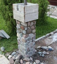 a fire hydrant sitting on top of a pile of rocks