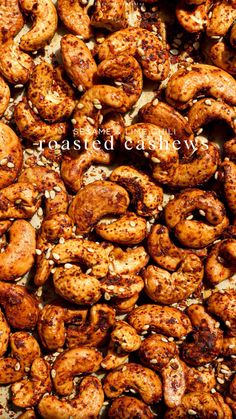 roasted cashews on a baking sheet with the words roasted cashews over them