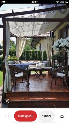 an image of a gazebo in the middle of a patio with chairs and tables