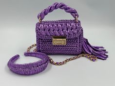 Product Title: Handbag For Woman,Handmade Metallic Bag,Lilac Metallic Bag,Luxury Lilac Woman Bag,Evening Crochet Bag,Knitted Metallic Shoulder Bag ✨Product Description: This hand-woven bag and headbang are a true masterpiece. It is meticulously crafted with 100% metallic yarn, making it not only beautiful but also durable. ✨The bag is lined inside and offers ample space to carry all your essentials. The lining is carefully sewn in to match the color of the handmade metallic bag, adding an extra Handmade Purple Shoulder Bag For Daily Use, Handmade Purple Tote Shoulder Bag, Handmade Purple Crochet Bag For Everyday, Handmade Purple Crochet Bag For Daily Use, Handmade Purple Shoulder Bag For Everyday, Purple Tote Shoulder Bag With Braided Handles, Purple Shoulder Bag With Braided Handles For Daily Use, Everyday Purple Crochet Bag, Daily Use Purple Crochet Bag