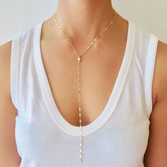 "This dainty chain lariat is adorned with a cubic zirconia accent. The cz drop hangs from the Y shaped chain This delicate necklace is great all by itself or combined with other necklaces for a dramatic layered look. Available in rose gold filled, gold filled, or sterling silver. Arrives gift wrapped! DETAILS & SIZE *The listing is for the coin lariat necklace *Available in our high quality 14K gold filled, rose gold filled or sterling silver chain and findings. *Drop from chain is 8\" in le Dainty Lariat Drop Necklace With Adjustable Length, Adjustable Lariat Drop Necklace With Delicate Chain, Minimalist Pearl Drop Lariat Necklace, White Lariat Clavicle Drop Necklace, Dainty Lariat Backdrop Necklace With Adjustable Length, Adjustable Long Drop Necklace With Delicate Chain, Dainty Long Drop Clavicle Chain Necklace, Dainty Adjustable Dangle Backdrop Necklace, Delicate Adjustable Dangle Drop Necklace