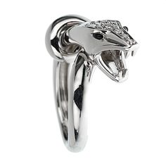 This exquisite Boucheron ring is a stunning representation of the brand's commitment to luxurious and innovative jewelry design. Crafted from 18k white gold, this ring showcases a striking snake motif, embodying both elegance and a touch of mystique. The ring features a meticulously designed snake, coiled gracefully around the finger. The head of the snake is the focal point, adorned with pavé-set diamonds that add a dazzling brilliance. These high-quality diamonds are expertly set to maximize t Kaa Snake, Boucheron Ring, Snake Coiled, Snake White, Boucheron Jewelry, Snake Motif, Onyx Eyes, Luxury Jewelry Brands, Gold Diamond Ring