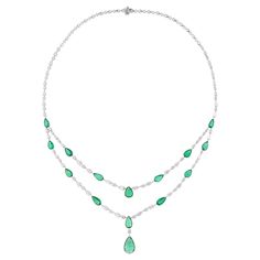 Experience the epitome of sophistication with this Real Zambian Emerald Gemstone Necklace, accented by radiant Diamonds and meticulously crafted in elegant 18 Karat White Gold. This exquisite piece of fine jewelry is a celebration of natural beauty and luxury, destined to become a cherished treasure in any collection. Item Code :- SEN-51200 Gross Wt. :- 28.28 gm 18k White Gold Wt. :- 24.62 gm Natural Diamond Wt. :- 7.34 Ct. ( AVERAGE DIAMOND CLARITY SI1-SI2 & COLOR H-I ) Emerald Wt. :- 10.95 Ct. Emerald Diamond Necklace, Modern Gold Jewelry, Central Market, White Gold Set, Zambian Emerald, Emerald Necklace, Necklace Wedding, Women Necklace, White Gold Jewelry