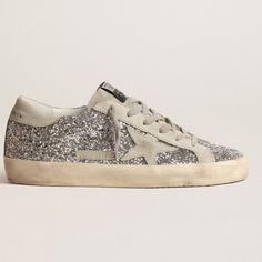 Super Comfortable And Chic Golden Goose Sneakers. Please Refer To My Photos Of Actual Shoes As The Cover Sample Is A Bit Of A Different Style. Good Used Condition. Very Much True To Size As I Am Almost Always An 8.5 In Shoes And These Are Very, Very Comfortable. The Current Listing On The Site Is Below And I Believe That All Measurements Are The Same. Https://Www.Goldengoose.Com/Us/En/Women-S-Super-Star-In-Silver-Glitter-With-Ice-Gray-Suede-Star-Cod-Gwf00101.F000416.70136.Html Golden Goose Sparkle Sneakers, Silver Golden Goose, Golden Goose Sneakers Blue, Golden Goose Sneakers Sale, Sparkly Sneakers, Golden Goose Silver, Golden Goose Silver Glitter, Shoes Golden Goose, Goose Shoes