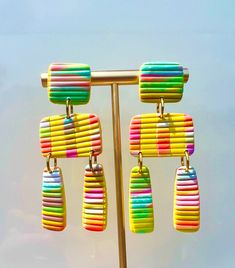 Our signature Scarlette earrings in Multiple colors. Colorful Vibrant Earrings With Ear Wire, Playful Yellow Dangle Earrings, Vibrant Rainbow Dangle Earrings, Colorful Fun Dangle Earrings, Fun Colorful Dangle Earrings, Rainbow Colorful Earrings For Gift, Trendy Multicolor Dangle Plug Earrings, Playful Rainbow Earrings With Ear Wire, Colorful Artsy Dangle Earrings