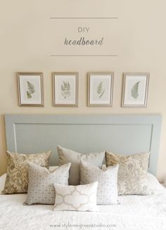 a bed with pillows and pictures on the wall above it that says diy headboard