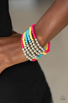 Held together with silver fittings, row after row of ornate silver and polished pink, yellow, and blue beads are threaded along with stretchy bands around the wrist for a colorful fashion. Sold as one individual bracelet. Paparazzi Accessories Jewelry, Candy Bracelet, Rose Gold Beads, Paparazzi Accessories, Blue Gems, Stretchy Bracelets, Layered Bracelets, Pink Beads, Yellow And Blue