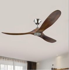 a ceiling fan that is hanging from the ceiling