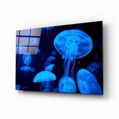 blue jellyfish floating in the water at night canvas wall art print on wrapped canvas