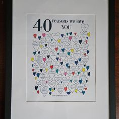 a framed poster with hearts and the words 40 reasons we love you written on it