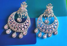 Silver Pastel pink Diamond Earrings Indian Pakistani bridesmaid wedding jewelry in silver plating Indian Jewelry are always a part of all the Indian celebration around the globe . One definitely complete her look once they own it . Beautiful  Indian cz earrings are plated in rhodium plating for longer lasting. This artistic silver cz Earrings looks beautiful  and elegant perfect for all occasion on any outfits you choose to wear (saree, salwar suits, lenga, etc.) *High quality craftsmanship 100% satisfaction guarantee  *Plated in rhodium plating *Earring Closure push black on earring  *base metal for earrings is brass * Earring length 7.7cm *Earring width 4.6cm  *package include earrings  *ready to ship from Houston TX United States GIFT- It comes in gift box perfect for gifting to your mo Pink Hand-set Bridal Earrings For Wedding, Pink Hand Set Bridal Earrings For Wedding, Elegant Pink Earrings For Reception, Elegant Pink Bridal Earrings For Reception, Pink Dangle Danglers For Wedding, Rose Gold Danglers For Wedding, Pink Danglers For Wedding, Pink Hand Set Earrings For Celebration, Pink Chandbali Bridal Earrings Gift